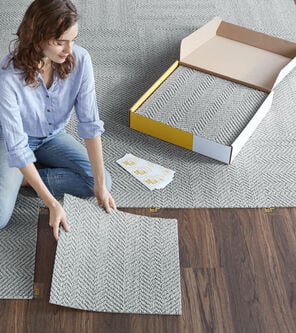 FLOR area rug being installed tile by tile